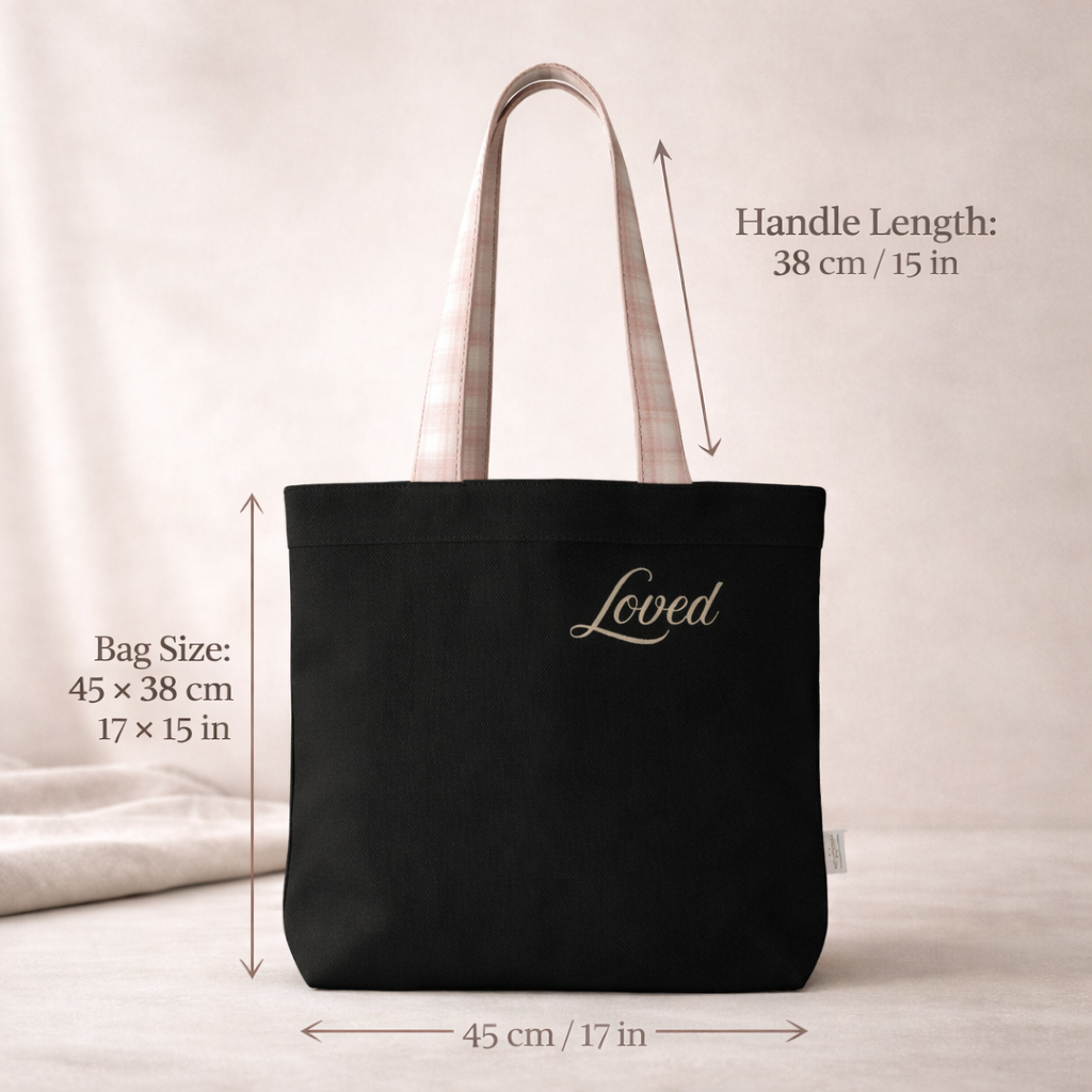 Black tote bag with 'Loved' text, shown with measurements on a neutral background.