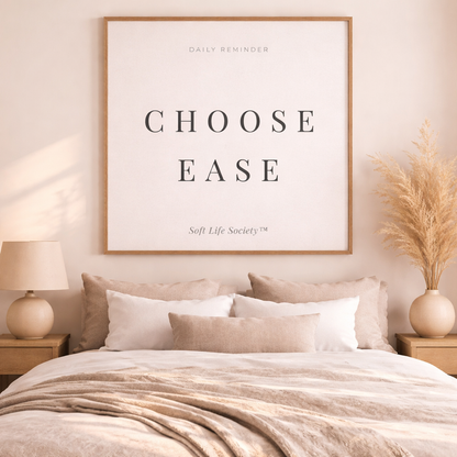 Bedroom with 'Choose Ease' poster on the wall