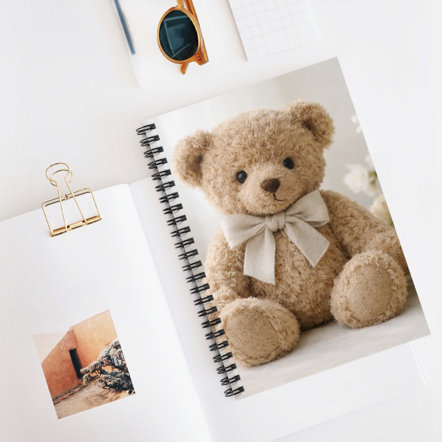 Soft Life Society spiral journal with teddy bear cover styled on a desk with minimal stationery