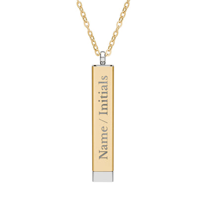 Gold necklace with a cylindrical pendant on a white background