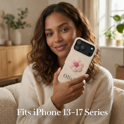 Woman holding a phone with a floral case in a cozy living room