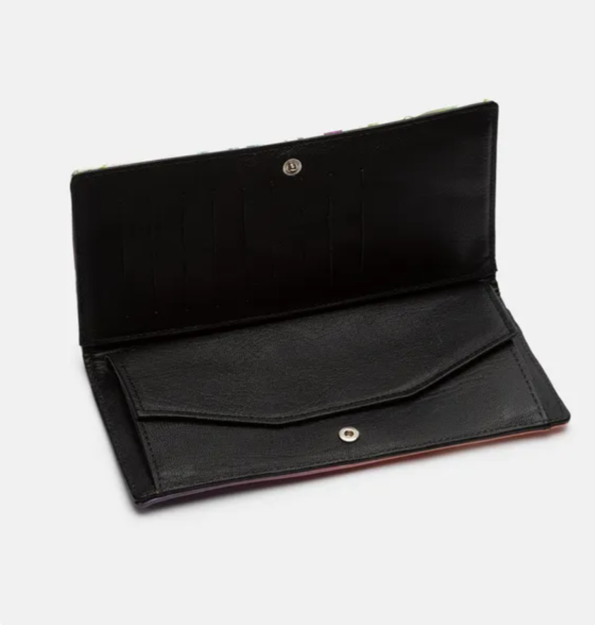 Interior view of the Amara Heritage Microprint™ travel wallet showing black leather lining and card slots.
