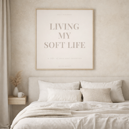 Beige bedroom with a framed quote on the wall above a bed.