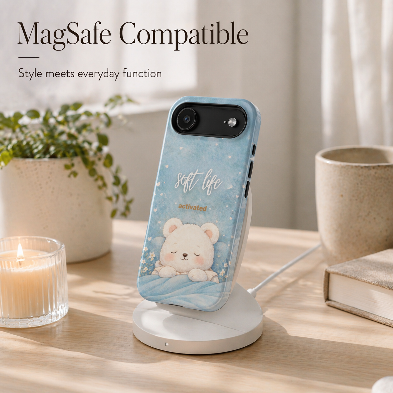 Soft blue bear phone case on MagSafe charging stand, minimalist desk setup, cozy neutral aesthetic