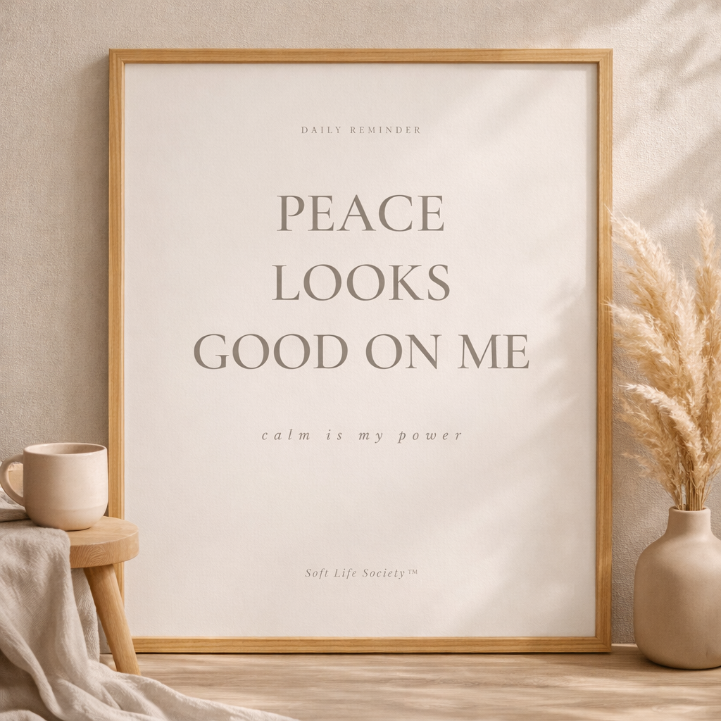 Framed print with 'Peace Looks Good on Me' text in a home setting with decor elements.