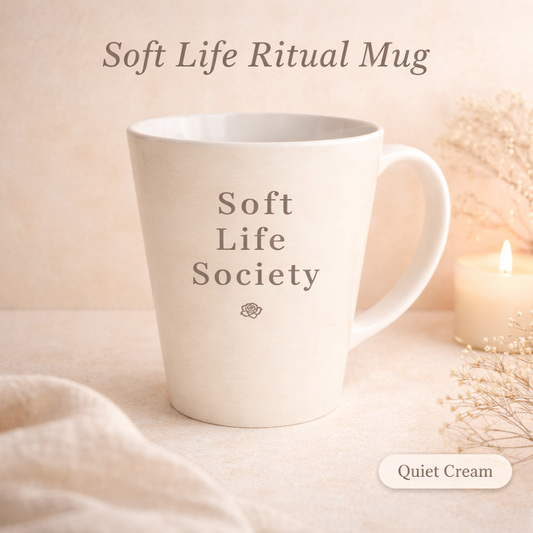 Cream mug with 'Soft Life Society' text on a soft beige background