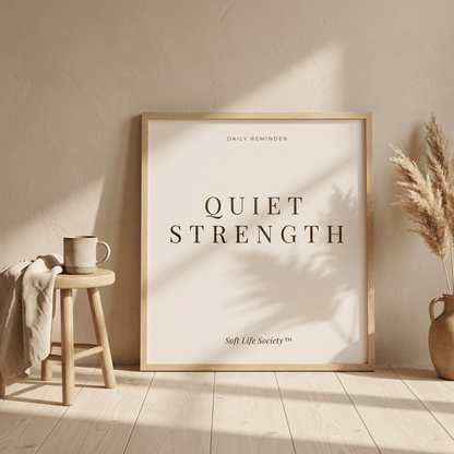 Framed artwork with 'Quiet Strength' text in a home setting