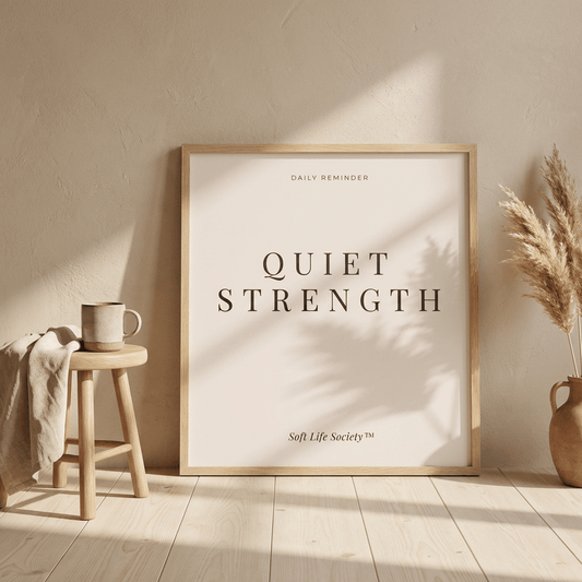 Framed artwork with 'Quiet Strength' text in a home setting