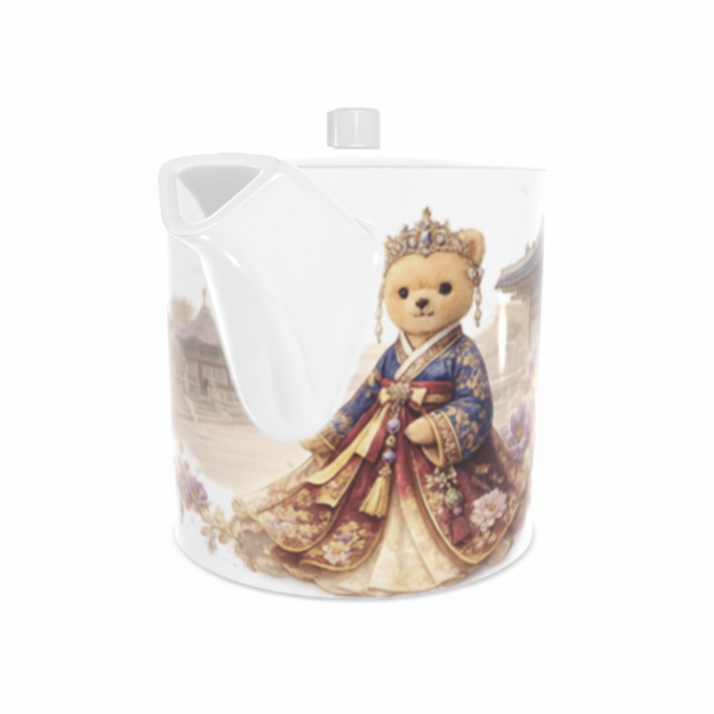 Teapot with a teddy bear in a royal costume on a white background
