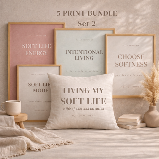 Set of framed prints with motivational phrases on a neutral background, accompanied by a pillow with a similar quote.