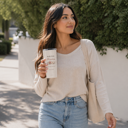 Woman walking outdoors holding Soft Life Mama tumbler and tote bag, everyday mom lifestyle with neutral outfit and aesthetic drinkware