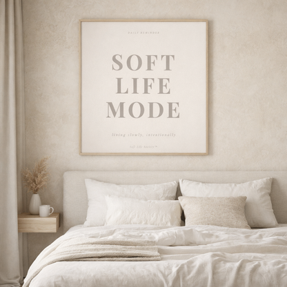 Beige bedroom with 'Soft Life Mode' framed print on the wall