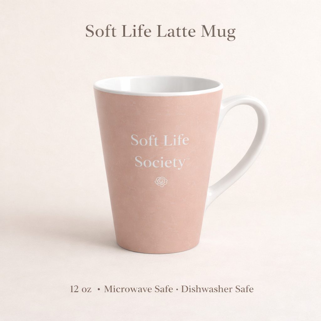 Blush peach mug with 'Soft Life Society' text on a light pink background