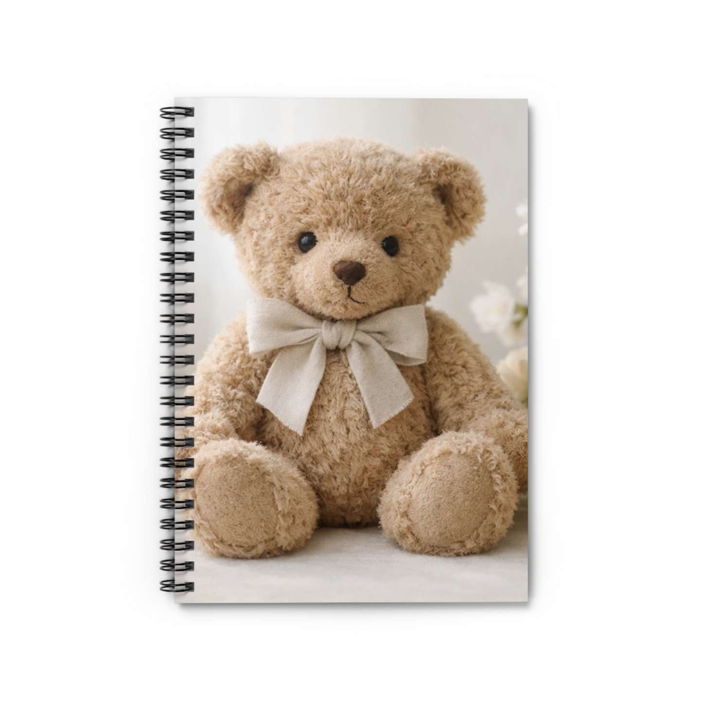 Soft neutral spiral journal featuring a teddy bear with a linen bow on a calming light background
