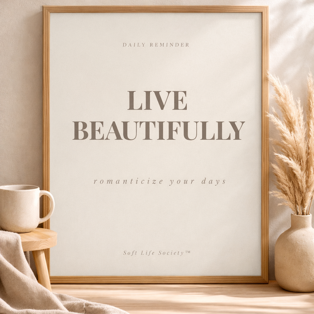 Framed print with 'Live Beautifully' text on a wall with decor elements.