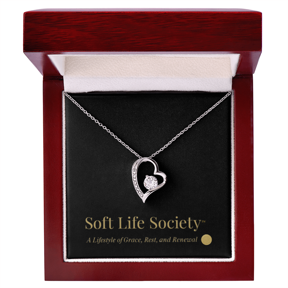 Silver Forever Love Necklace inside mahogany luxury box with branded message card.