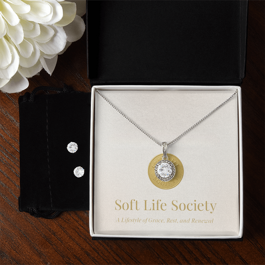 Timeless solitaire pendant necklace with matching earrings displayed in Soft Life Society deluxe jewelry box.
