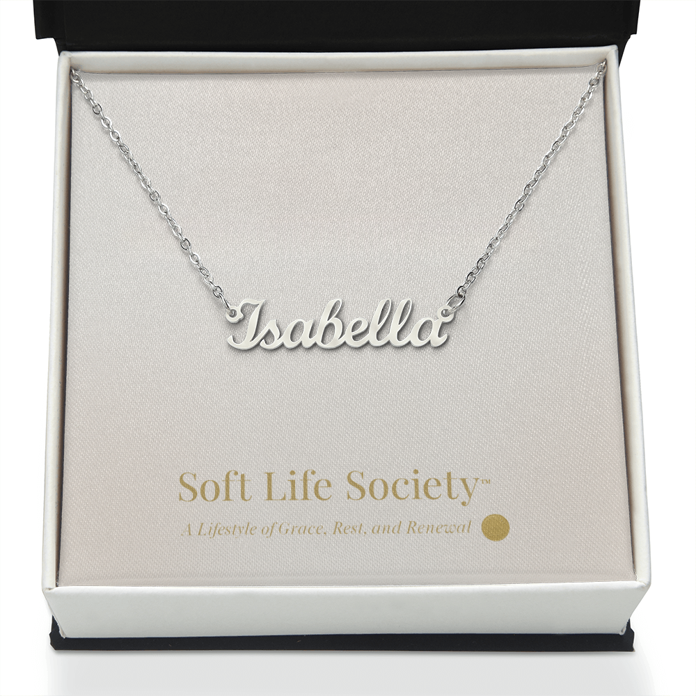 Silver personalized name necklace ‘Isabella’ presented in the Soft Life Society™ standard white gift box.