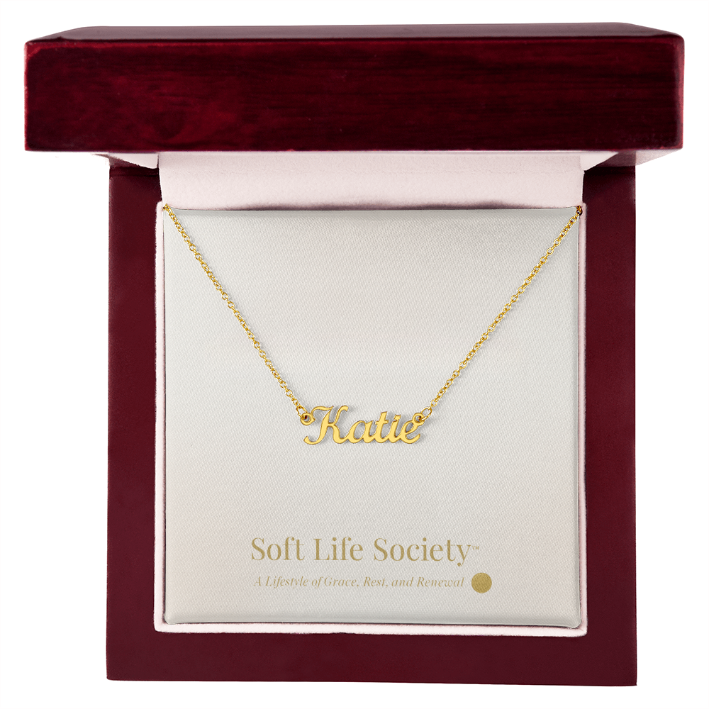 Silver personalized name necklace displayed inside a Soft Life Society™ luxury mahogany gift box.