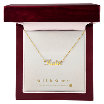 Silver personalized name necklace displayed inside a Soft Life Society™ luxury mahogany gift box.