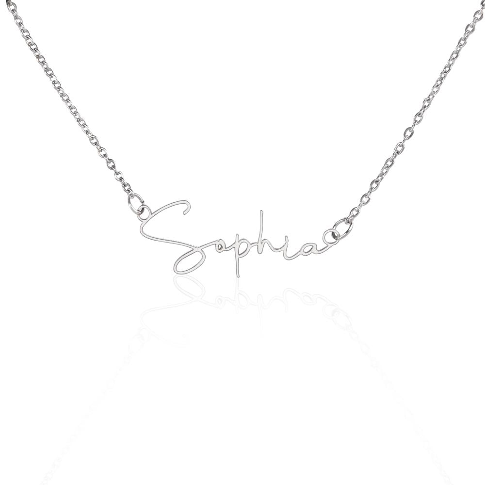 Soft Life Society Signature Style Name Necklace in polished silver featuring custom “Sophia” script pendant on reflective white background.