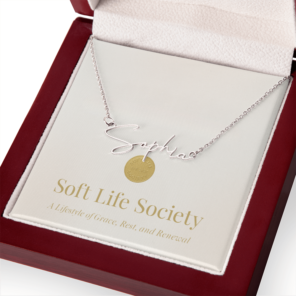 Soft Life Society Signature Style Name Necklace in silver with “Sophia” pendant displayed in a mahogany luxury gift box with gold logo and soft white interior.