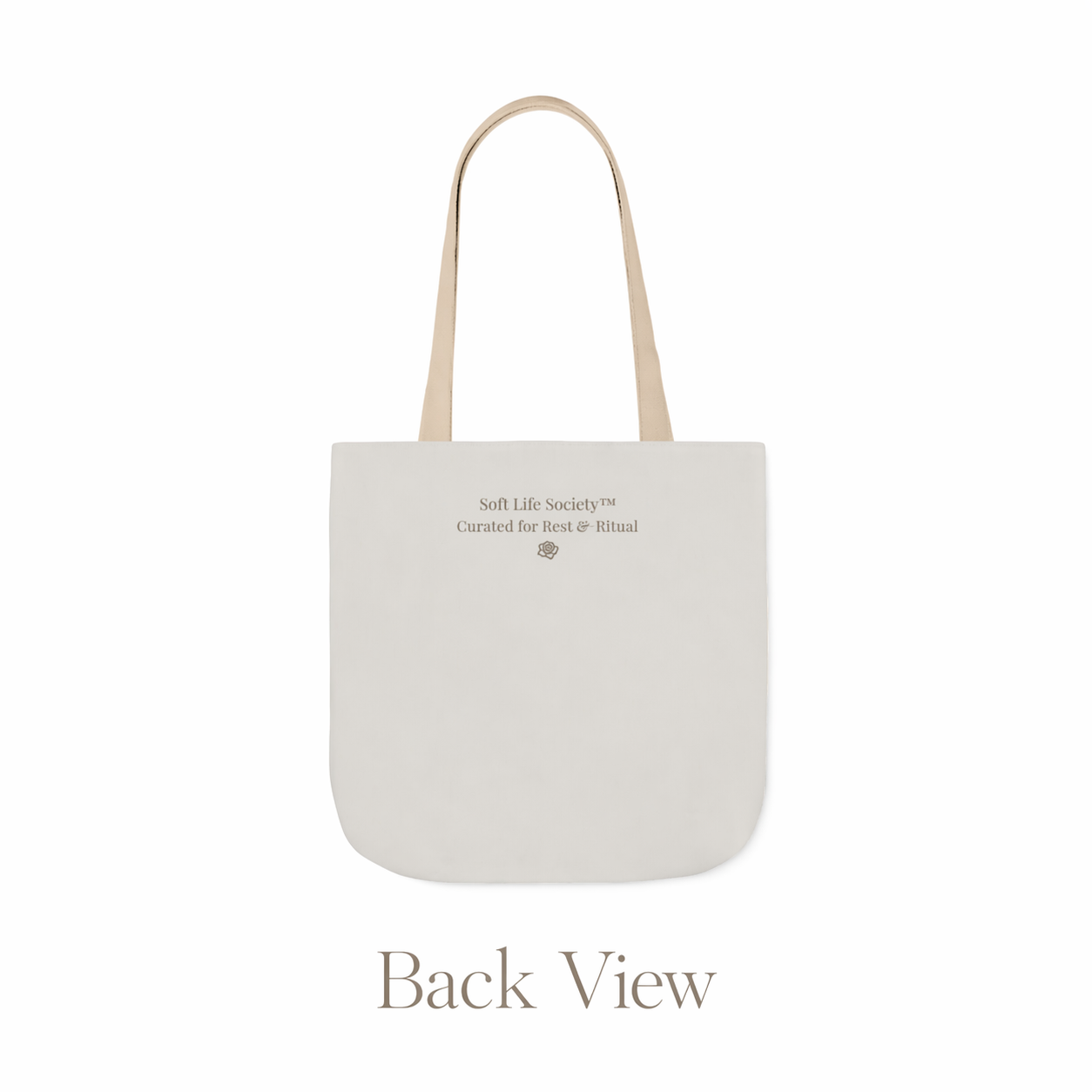 Back view of beige tote bag with 'Soft Life Society' text on a white background