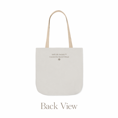 Back view of beige tote bag with 'Soft Life Society' text on a white background