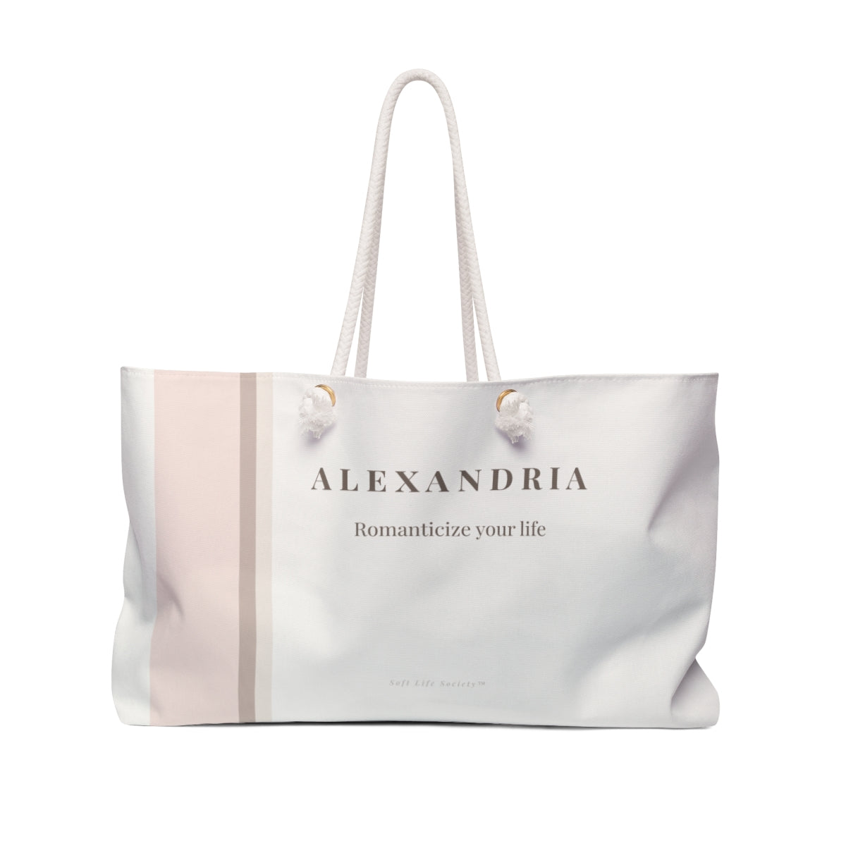 Blush striped cream and blush striped weekender tote bag with rope handles.