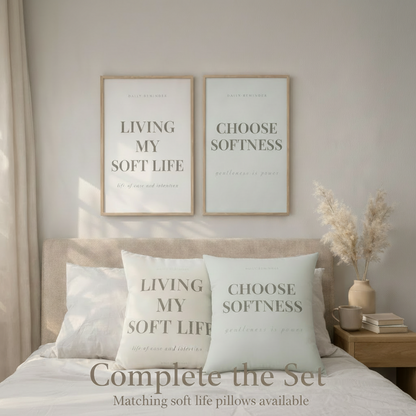 Bedroom with pillows and wall art featuring motivational phrases.