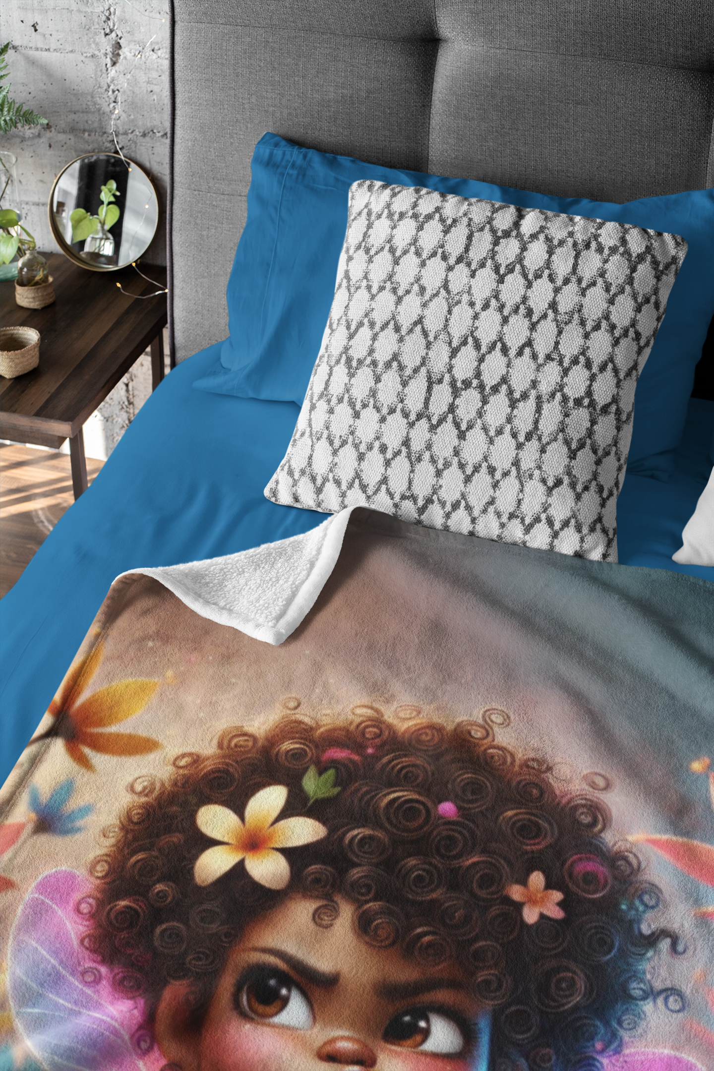 Vibrant fairy-themed blanket featuring Zuri, placed on a stylish bed with blue and white bedding in a contemporary room.