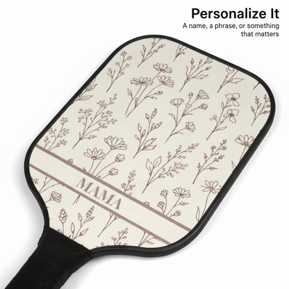 Paddle with floral pattern and 'MAMA' text on a white background