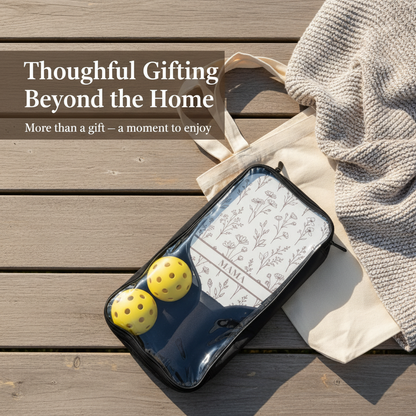 Black case with yellow balls on a wooden surface with text 'Thoughtful Gifting Beyond the Home'.