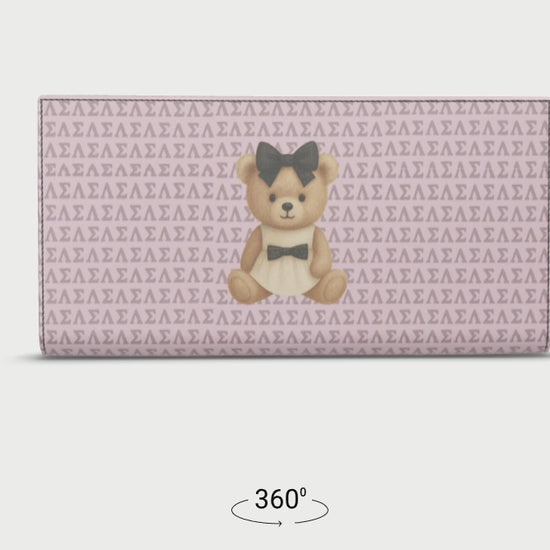 360-degree rotating view of the Le Petit Teddy™ Noir Microprint Wallet, showing the full-grain Nappa leather texture, couture teddy emblem, and repeating Greek-letter monogram from all angles.