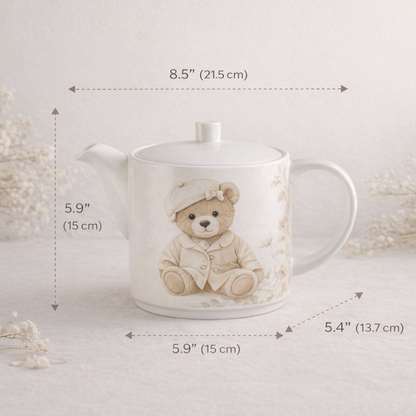 Teapot with teddy bear design and measurements on a light background